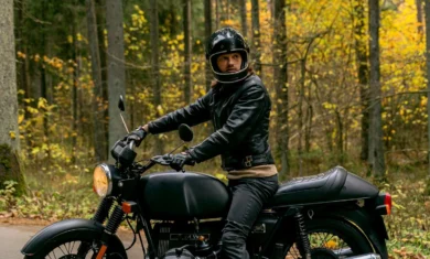 Biker on a cafe racer in leather jeans and jeans