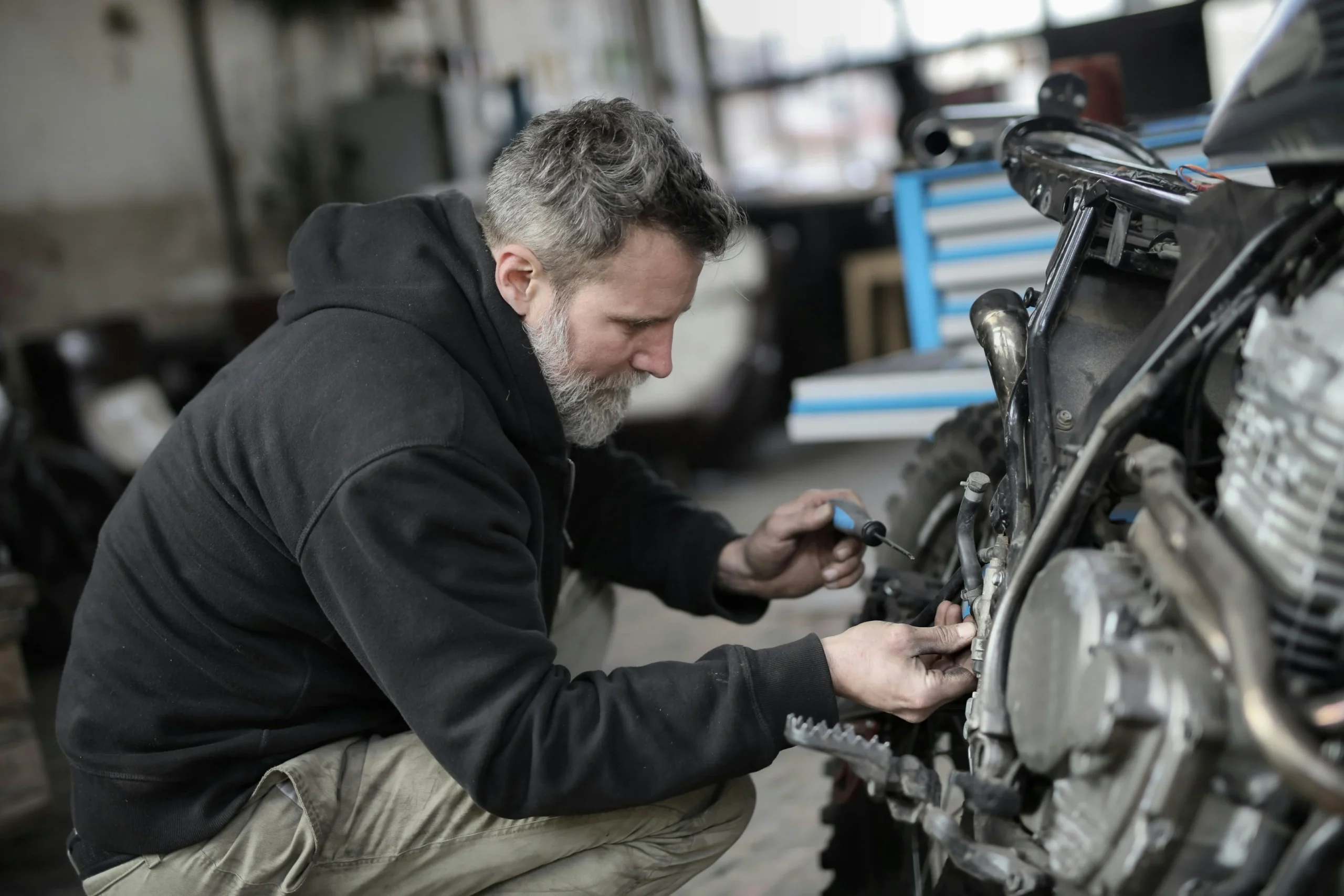 Man repairing a motorcycle