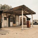 Route 66 - Iconic. Legendary. white van parked in front of brown wooden house during daytime