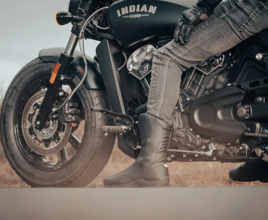Motorcycle Riding Jeans Pants a man riding on the back of a motorcycle
