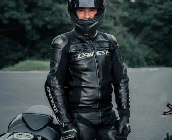 Motorcycle Riding Jeans Pants man in black leather jacket and helmet riding motorcycle