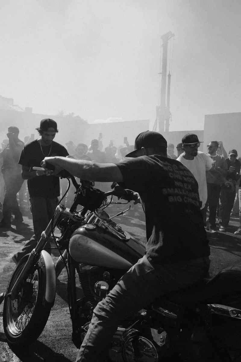 Motorcycling Blogs & Reviews Man on motorcycle with crowd in background