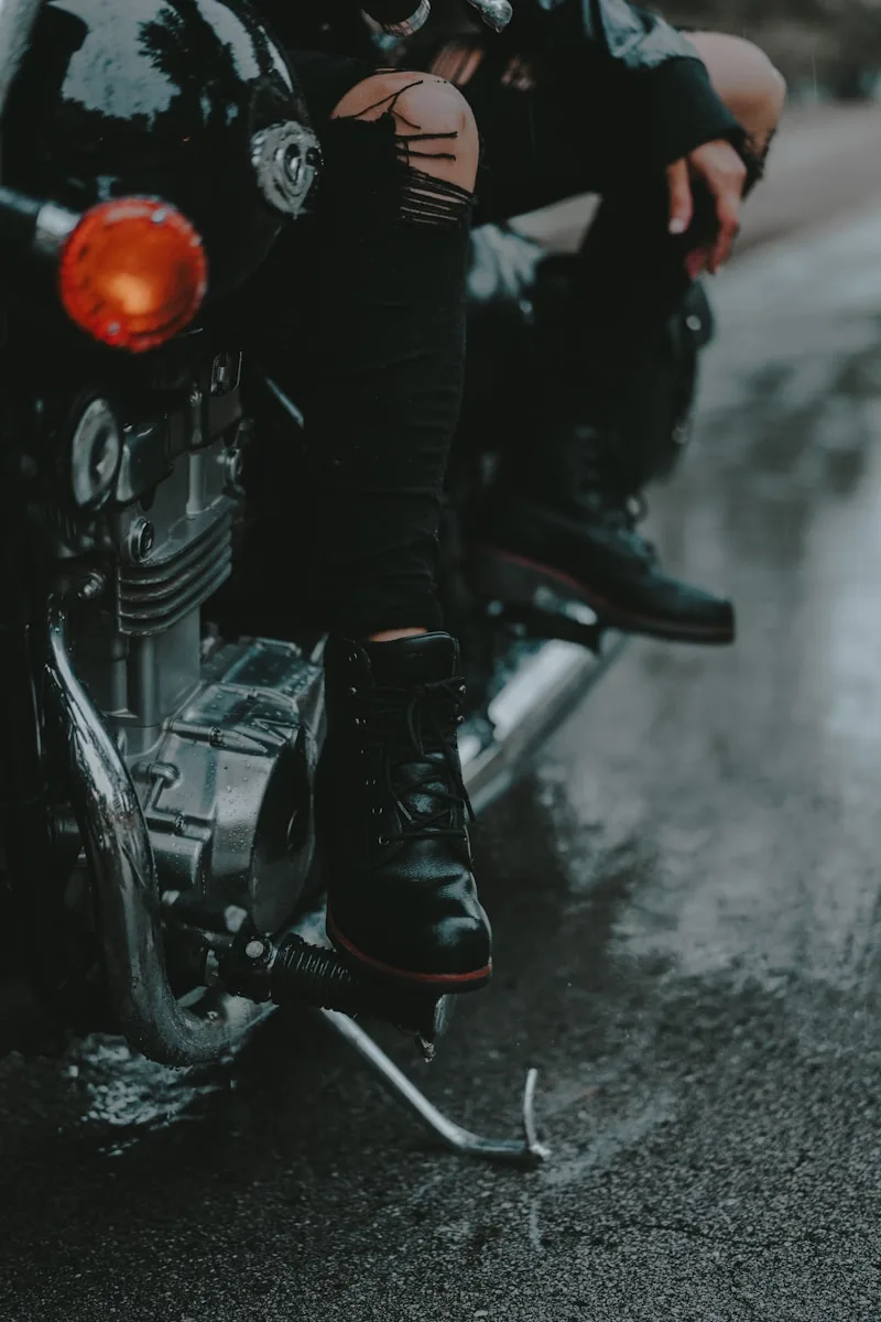 Motorcycling Blogs & Reviews a man sitting on a motorcycle in the rain