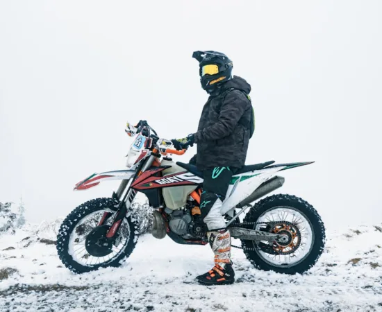 Motorcycle Riding Jackets a person on a dirt bike in the snow