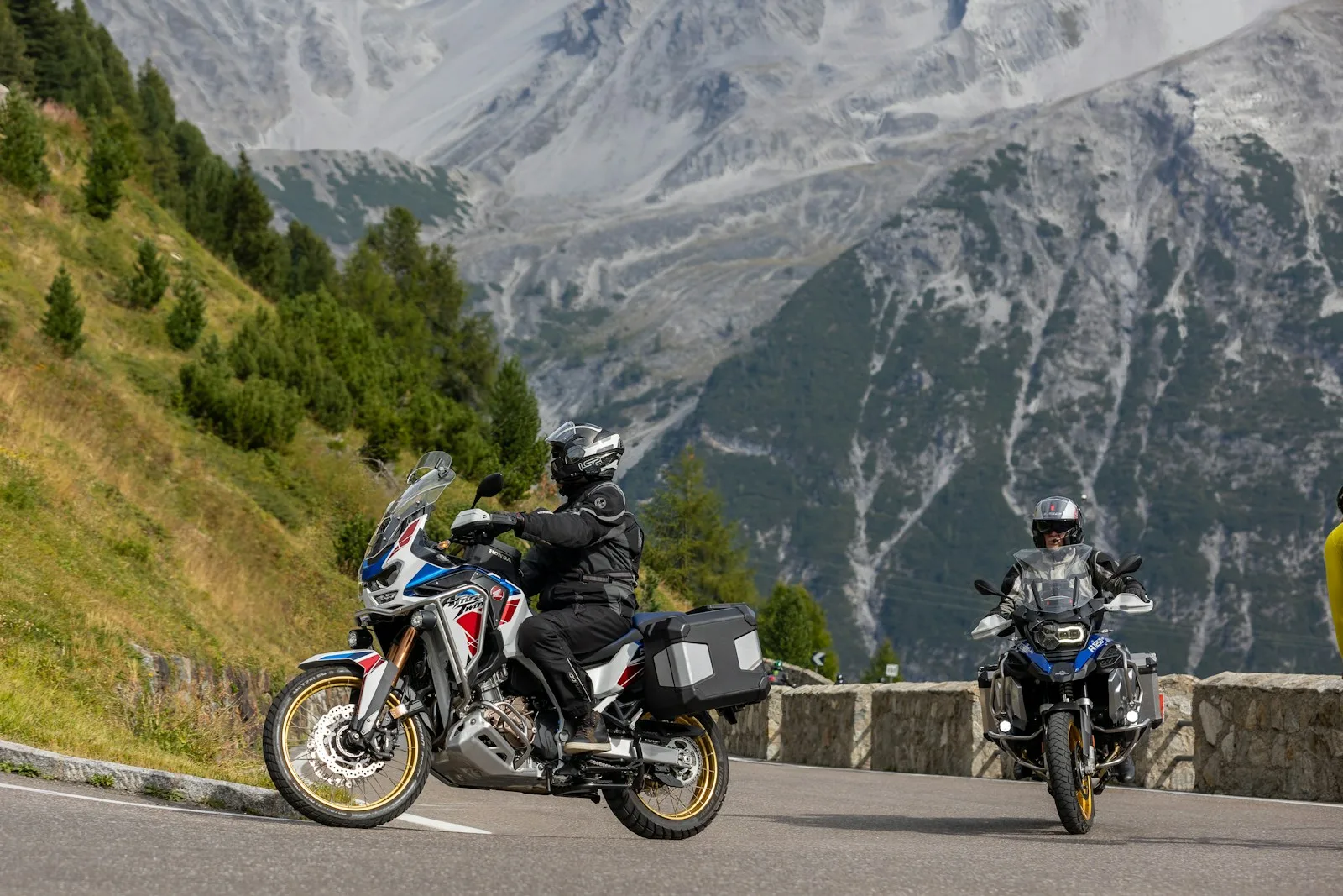 Motorcycle Riding Jeans Pants two motorcyclists riding down a mountain road