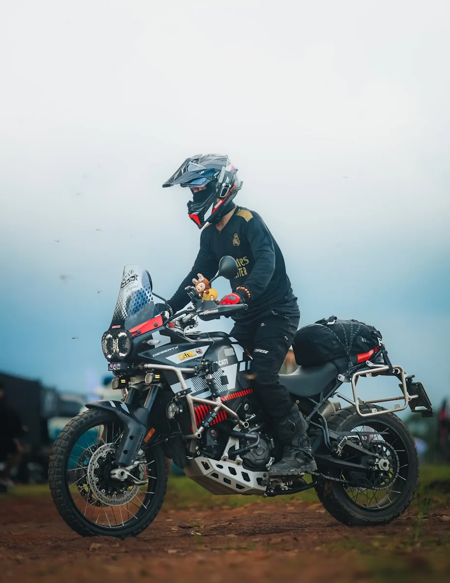 Motorcycle Riding Boots Rider on adventure motorcycle with luggage