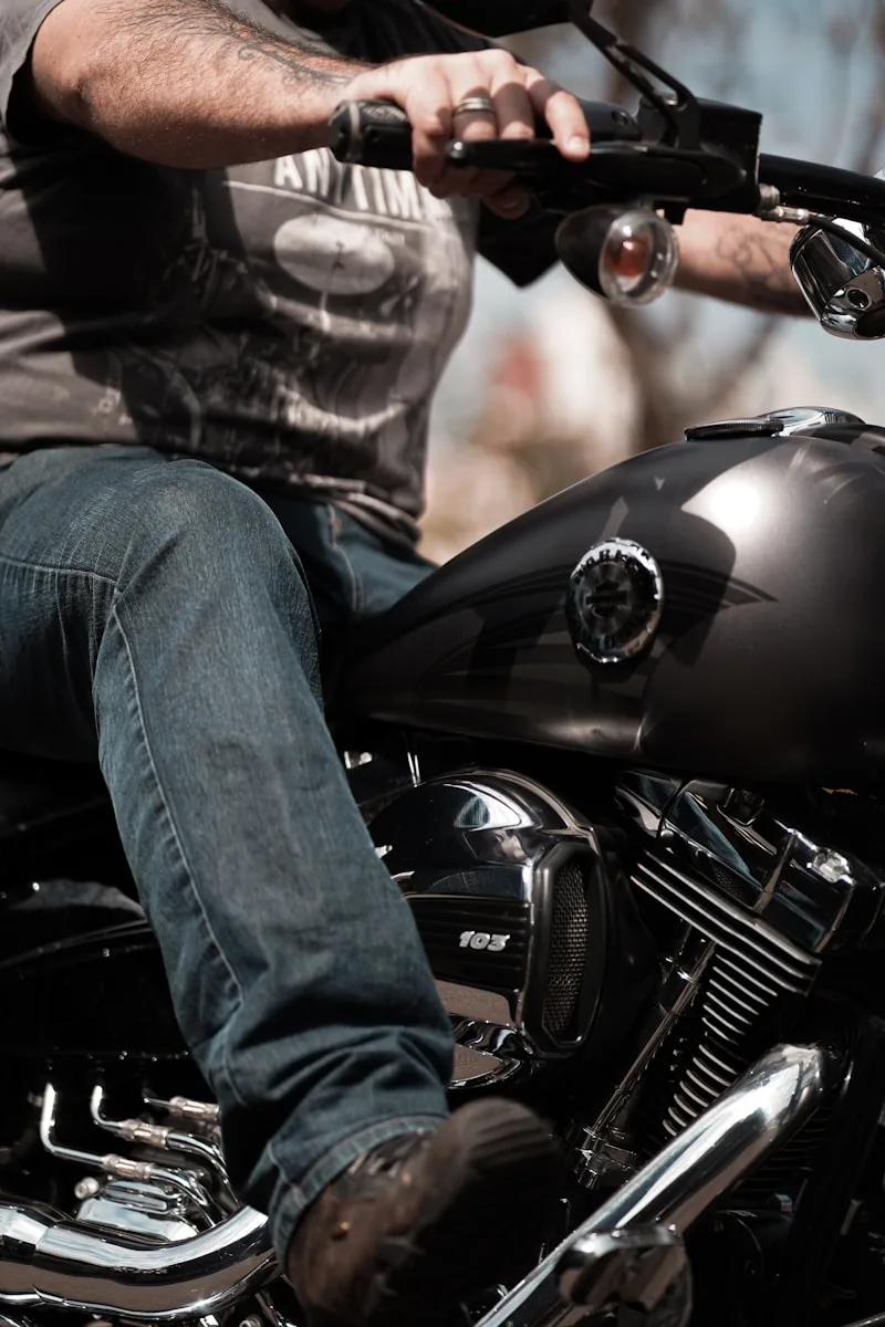 Motorcycling Blogs & Reviews person in blue denim jeans sitting on black motorcycle